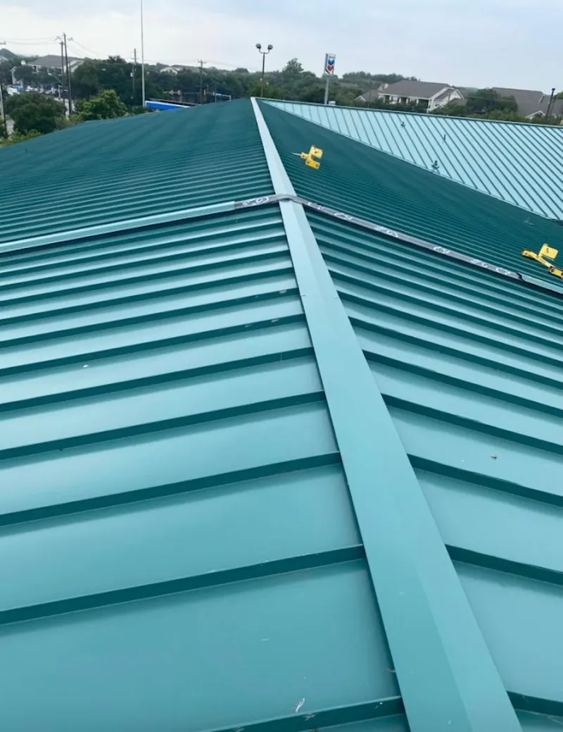 Green commercial metal roof ridge and valley for Metal Roof Repair in Scottdale